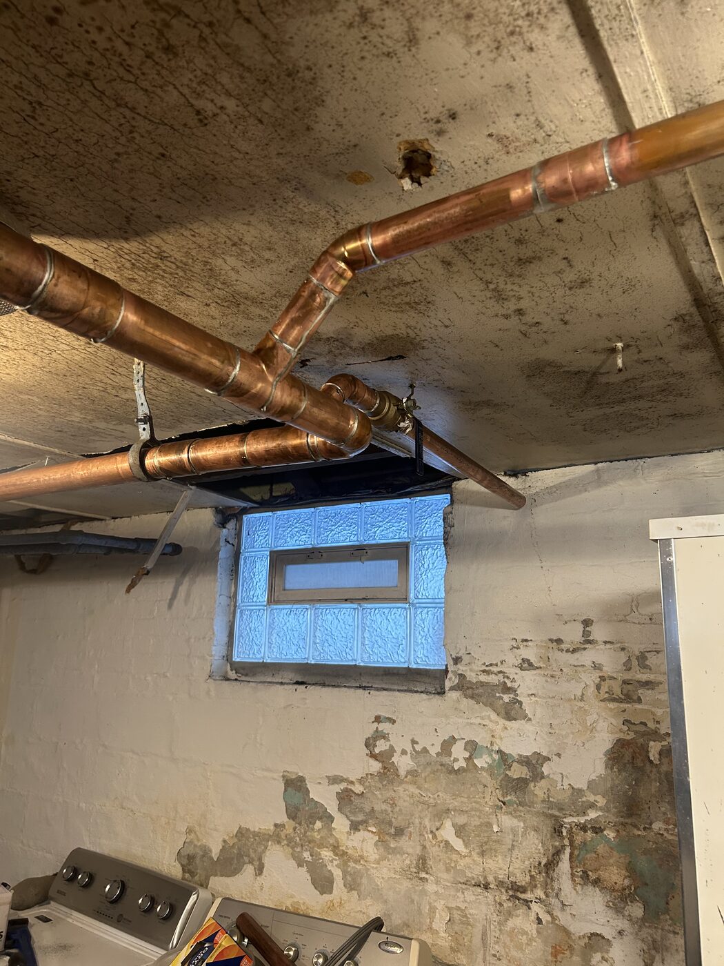 Copper pipe repair in an older Indianapolis home's basement