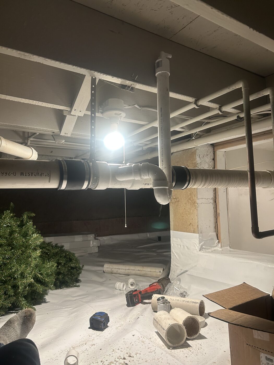 Pipe installation along a basement ceiling
